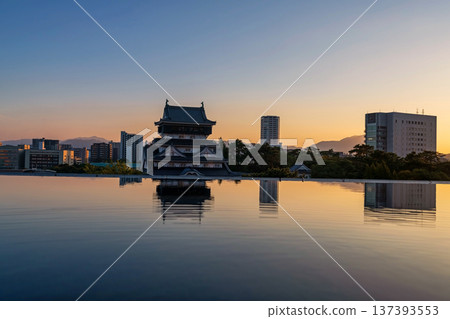 Kokura Castle with skyline reflection on water at dusk, Kitakyushu 137393553