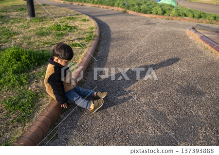 A sulky boy in the park A sulky boy in the park 137393888