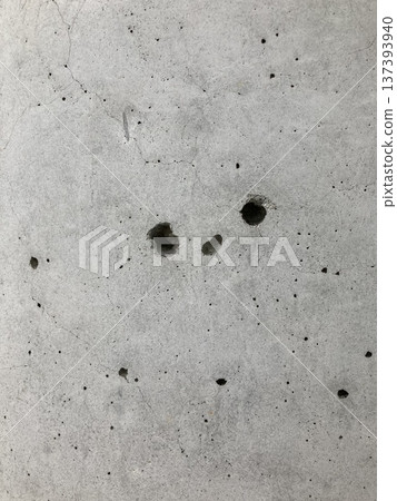 A hole in a concrete wall that looks like it's smiling A hole in a concrete wall that looks like it's smiling 137393940