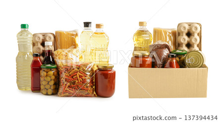 Foodstuffs in donation box isolated on white background. Foodstuffs in donation box isolated on white background. 137394434