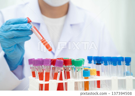 Scientist medical professional use test tube for research in science laboratory. 137394508