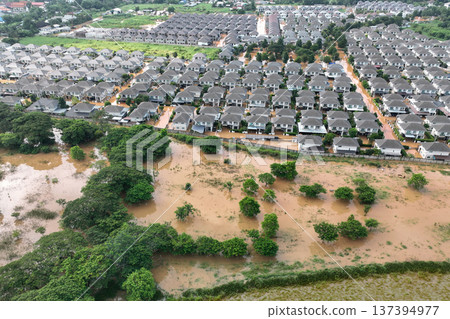 Tropical rainstorm flooded residential homes in suburban community in Chiang Mai, Thailand. 137394977