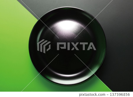Black plate_black and green background Black plate_black and green background 137396856