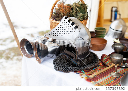 Historic reenactment scene. Outdoor reenactment showing period gear and natural decor elements 137397892