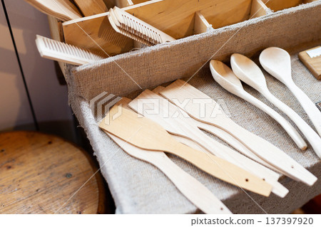 Artisan crafted wooden kitchen tools displayed in feltlined crate with neutral tones Artisan crafted wooden kitchen tools displayed in feltlined crate with neutral tones 137397920