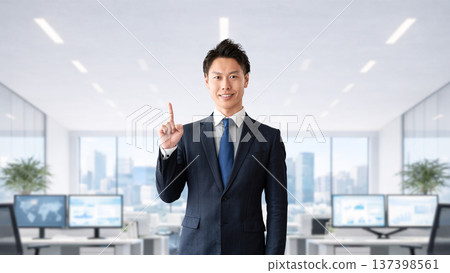 A male businessman pointing his index finger to guide you 137398561