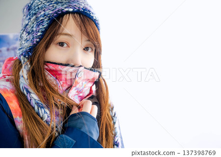 Young woman riding a gondola at a ski resort 137398769