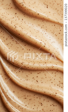 Creamy cosmetic smear in macro style on neutral cappuccino backdrop showing skincare texture with smooth detail concept 137399020