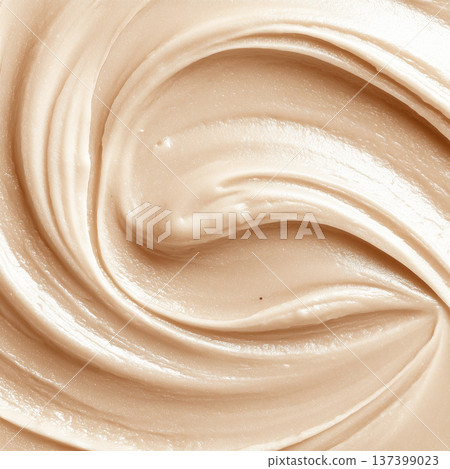 Creamy cosmetic smear in macro style on neutral cappuccino backdrop showing skincare texture with smooth detail concept 137399023