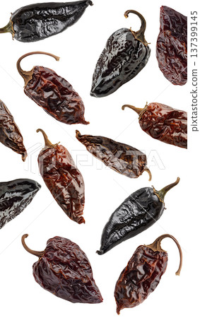 Dried chili peppers scattered and isolated on white background, spicy food concept, showcasing culinary ingredients texture 137399145