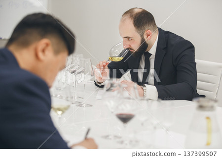 Sommelier degustate wine. Blind wine tasting. Training of restaurant staff, studying alcohol list.  137399507