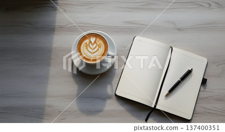 Minimalist writer's desk with coffee and open notebook 137400351