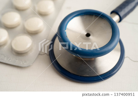 Stethoscope on electrocardiogram ECG with drug, heart wave, heart attack, cardiogram report. 137400951