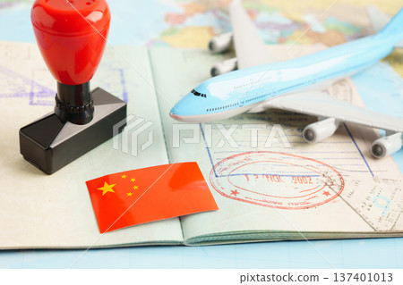 China passport with approved stamp on document for tourism. China passport with approved stamp on document for tourism. 137401013
