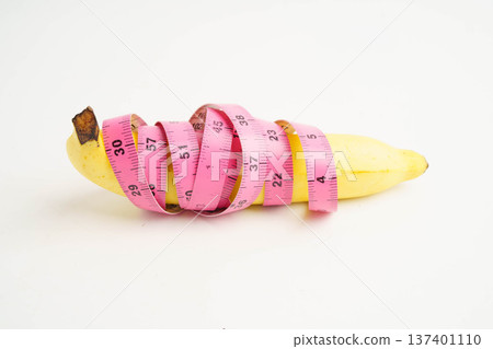 Banana with measuring tape, penis health. Banana with measuring tape, penis health. 137401110
