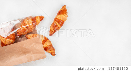 Fresh Croissants in Paper Bag on Light Background Top View Fresh Croissants in Paper Bag on Light Background Top View 137401130