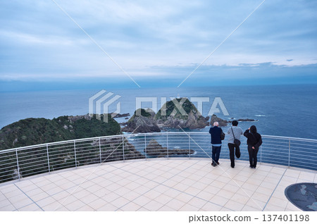 Back view of tourists at the observation deck from Cape Sata Back view of tourists at the observation deck from Cape Sata 137401198