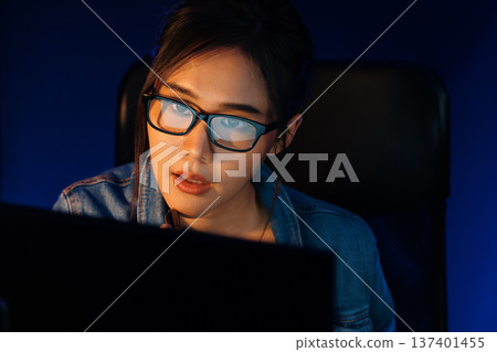 Portrait young creative with glasses of serious face looking on pc. Stratagem. Portrait young creative with glasses of serious face looking on pc. Stratagem. 137401455