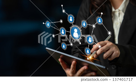 Business Professional Engaging with Digital Network Connections through Tablet Touchscreen Technology in a Modern Office Setting. Tessel Business Professional Engaging with Digital Network Connections through Tablet Touchscreen Technology in a Modern Office Setting. Tessel 137401717
