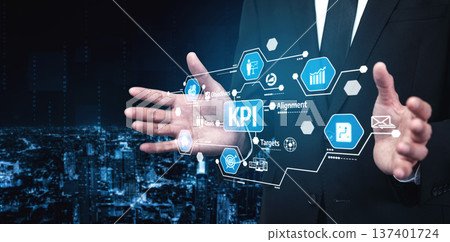 Businessman Using Digital Interface to Analyze Key Performance Indicators in a Modern Cityscape, Showing Targets, Metrics, and Data Alignment for Success. Tessel 137401724
