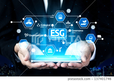 Hands Holding Tablet with Digital ESG Icons for Green Business, Environmental, Social, Governance, and Ecological Responsibility in Modern Technology. Tessel 137401746