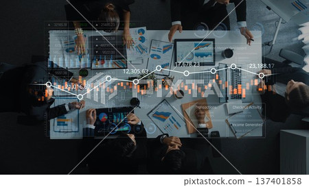 Aerial View of Business Team Analyzing Data and Charts with Digital Graphs on Conference Table in Modern Office Setting. Raster Aerial View of Business Team Analyzing Data and Charts with Digital Graphs on Conference Table in Modern Office Setting. Raster 137401858