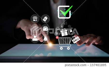 Digital Shopping Experience with Shopping Cart Icon and Checkmark on Touchscreen Device with E-commerce Symbols in a Modern Business Setting Quark 137401895