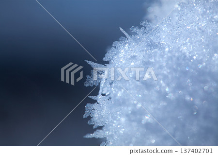 macro shot of ice crystals. Winter pattern with white snowflakes macro shot of ice crystals. Winter pattern with white snowflakes 137402701