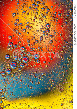 Fiery red and yellow oil drops on blue background abstract liquid art Fiery red and yellow oil drops on blue background abstract liquid art 137402966