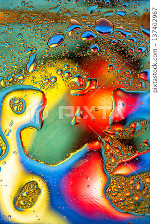 Iridescent oil on water macro with prismatic rainbow color reflections Iridescent oil on water macro with prismatic rainbow color reflections 137402967