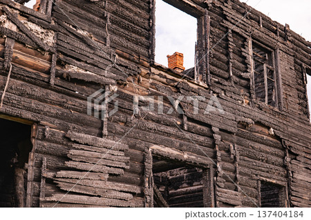 Ruined building after a fire, displaying devastation, remains, and abandonment 137404184