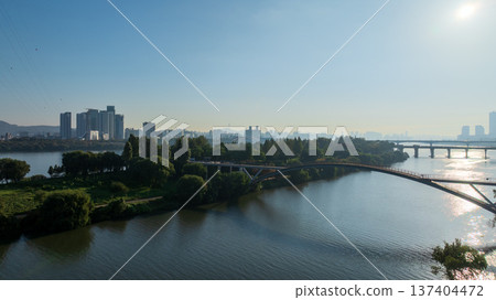 Aerial cinematic sunrise over Seonyudo Park and Hangang River with Yeouido skyline, Seoul. 137404472