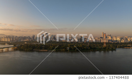 Aerial cinematic sunrise over Seonyudo Park and Hangang River with Yeouido skyline, Seoul. 137404488