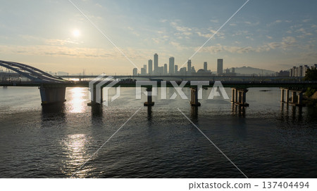 Aerial cinematic sunrise over Seonyudo Park and Hangang River with Yeouido skyline, Seoul. 137404494