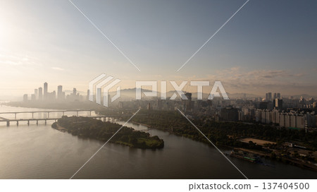Aerial cinematic sunrise over Seonyudo Park and Hangang River with Yeouido skyline, Seoul. 137404500