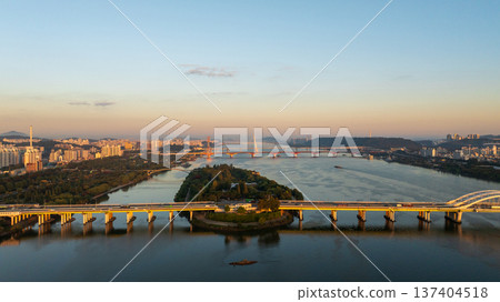 Aerial cinematic sunrise over Seonyudo Park and Hangang River with Yeouido skyline, Seoul. 137404518