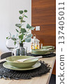 modern dining table setting with eucalyptus 137405011