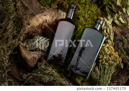 Vintage bottles with tinctures and various dried herbs. 137405170