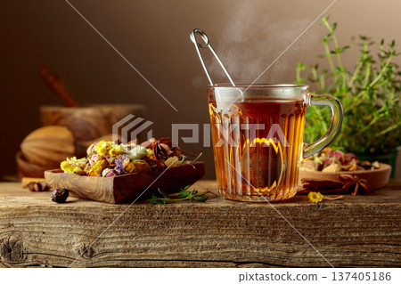 Herbal tea with ingredients on a old wooden table. 137405186