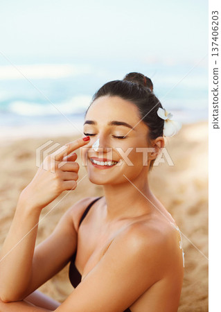 Suncream. Suntan Lotion Beautiful Woman Applying on beautifu on Face. Sunscreen Solar Cream. Skin care. Sun protection.The Girl Uses Moisturizer Sunblock Suncream. Suntan Lotion Beautiful Woman Applying on beautifu on Face. Sunscreen Solar Cream. Skin care. Sun protection.The Girl Uses Moisturizer Sunblock 137406203