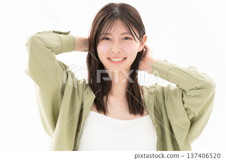 Beauty image of a woman doing skin care on a white background Beauty image of a woman doing skin care on a white background 137406520