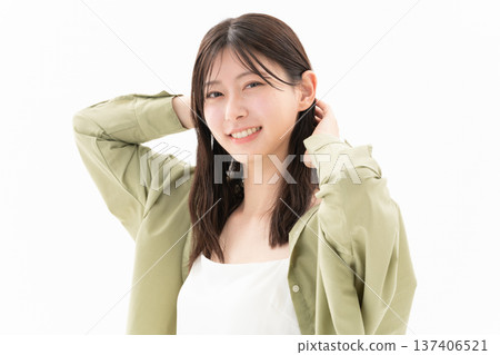Beauty image of a woman doing skin care on a white background Beauty image of a woman doing skin care on a white background 137406521