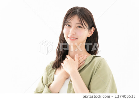 Beauty image of a woman doing skin care on a white background 137406535