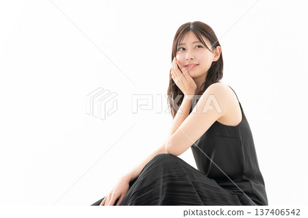 Beauty image of a woman doing skin care on a white background Beauty image of a woman doing skin care on a white background 137406542