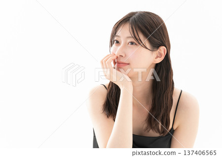 Beauty image of a woman doing skin care on a white background Beauty image of a woman doing skin care on a white background 137406565
