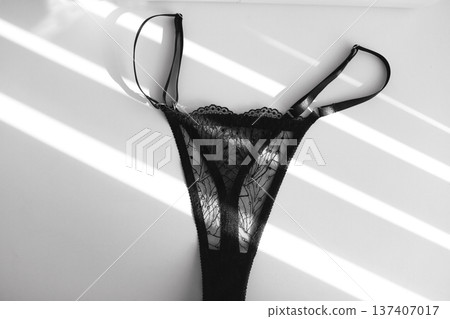black lacy panties isolated over white. Shopping and fashion concept. glamorous stylish sexy lace lingerie, woman accessories on white background. Top view point, flat lay. High quality photo black lacy panties isolated over white. Shopping and fashion concept. glamorous stylish sexy lace lingerie, woman accessories on white background. Top view point, flat lay. High quality photo 137407017