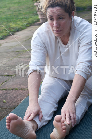 Mature Woman Practicing Yoga at Home Mature Woman Practicing Yoga at Home 137407231