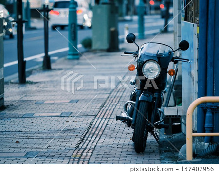 Scenery with a motorcycle on the sidewalk Scenery with a motorcycle on the sidewalk 137407956