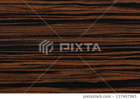 Brown ebony veneer background for your unusual design project. High quality wooden texture 137407965