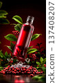 A bottle of cranberry juice with ice cubes and berries 137408207